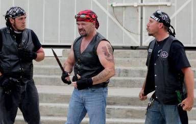 Clint as a biker in a local play (center)